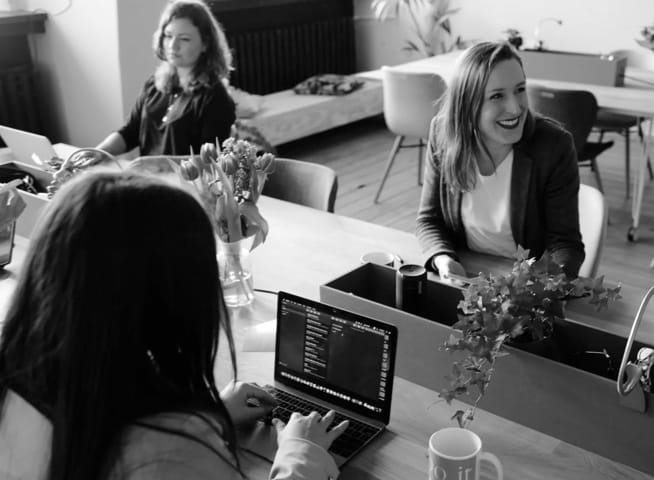 people working on desk together